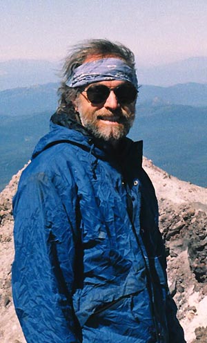 photo of Evan Sugden looking like Mountain Man on summit of Mt.Lassen