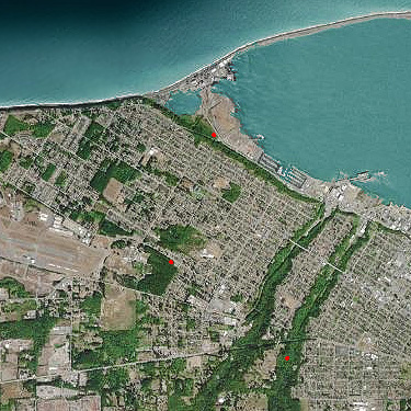 recent aerial photo of Port Angeles area with 3 natural spider habitats visited, marked in red
