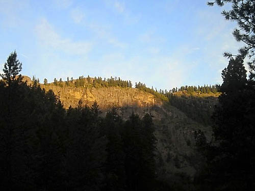first sunlight hits cliff top, Thirteenmile Creek Trailhead, Ferry County, Washington