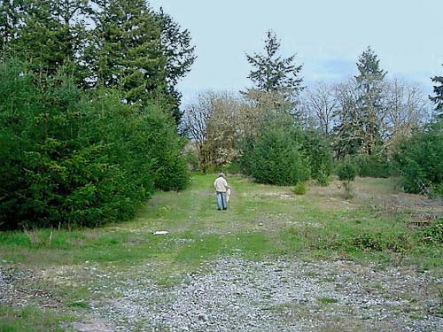 Rod Crawford leaving site at end of day, prairie remnant sites near Gate, Thurston County, Washington