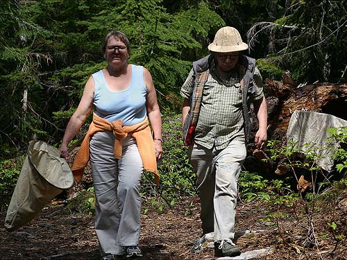 Rod guides Della to the return trail at Kelcema Lake, Snohomish County, Washington