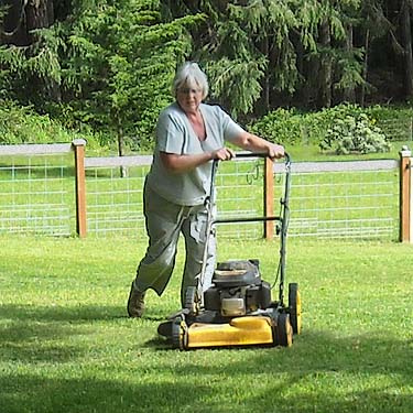 Jean Knapp mowing her lawn near Langley, Whidbey Island, Washilngton