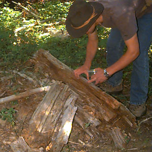 Jeff Benca collecting spiders from log, Liars Prairie, Washington