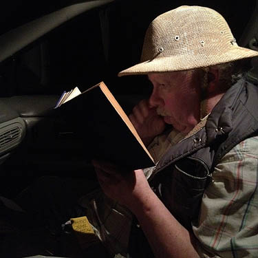 Rod Crawford reading a Sax Rohmer book while waiting for Hood Canal Bridge to open, 7 May 2012