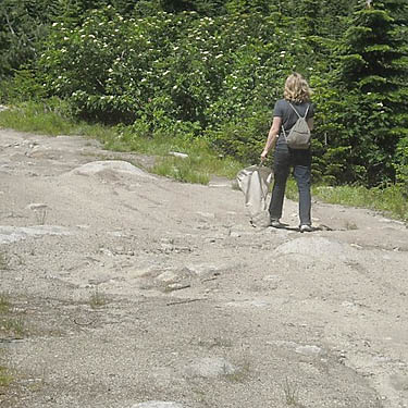 Matisse Lorance walks rough road, Rainy Creek Pass, Nason Ridge, Chelan County, Washington