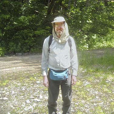 Larry McTigue wearing his anti-mosquito hiking suit, Sloan Creek Road 49 end, Snohomish County, Washington