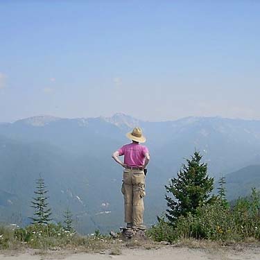 Laurel Ramseyer standing on stump, Sun Top (mountain), Pierce County, Washington