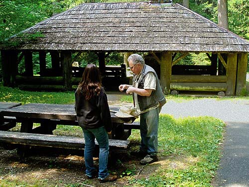 Rod Crawford and Shannon Bowley at picnic table, The Dalles Campground, Pierce County, Washington