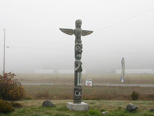 fake totem pole at Hwy. 20 and Troxell Road, Whidbey Island, Washington in the fog