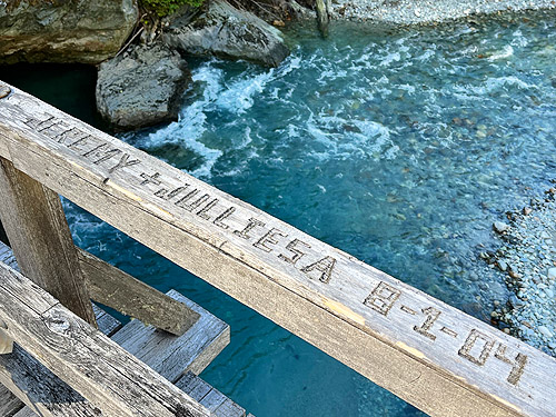 lovers' carving on railing, Baker River Trail at suspension bridge, Whatcom County, Washington
