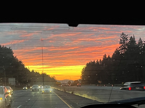 sunset through rear car window, south of Olympia along I-5, 7 October 2024