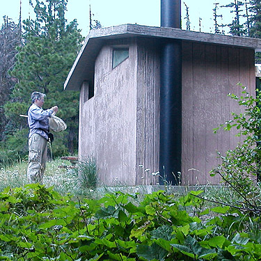 Laurel Ramseyer collects spiders on outhouse, Esmeralda Trailhead, Kittitas County, Washington
