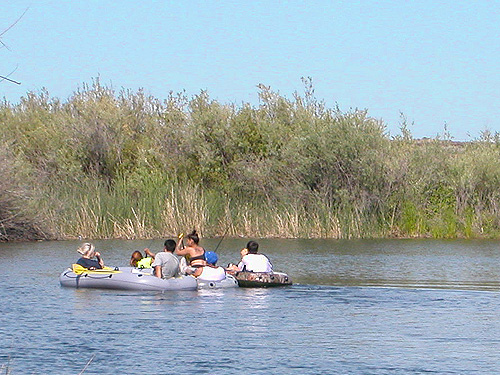 tourists in rubber boat, SW corner of Evergreen Reservoir, Grant County, Washington