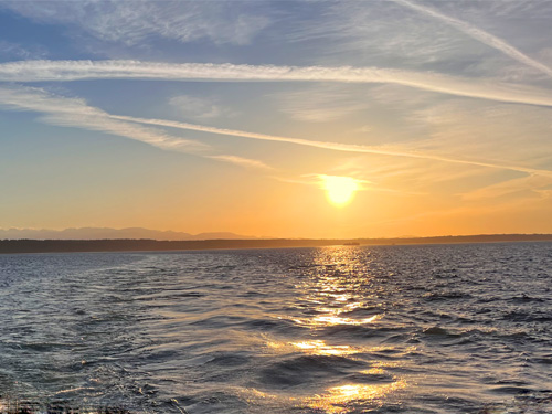 sinking sun behind Kingston-Edmonds ferry, 15 May 2024