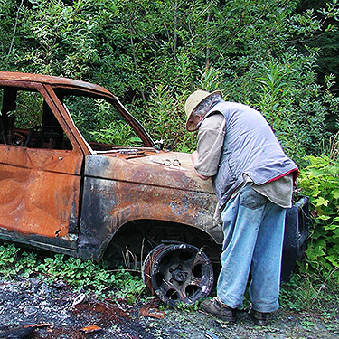 Rod Crawford writes specimen labels on an old truck, Iron Creek at USFS Road 16, Skagit County, Washington
