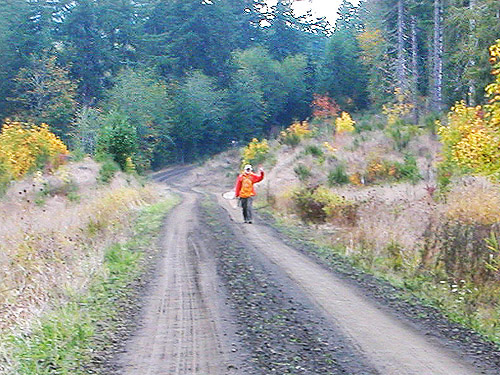 Jerry Austin carries his net for the last time, Lepisto Road end near North Fork Lincoln Creek, Lewis County, Washington