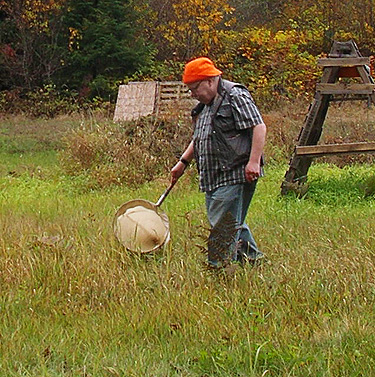 Rod Crawford sweeping grass, Nooksack River 1 mile E of Maple Falls, Whatcom County, Washington