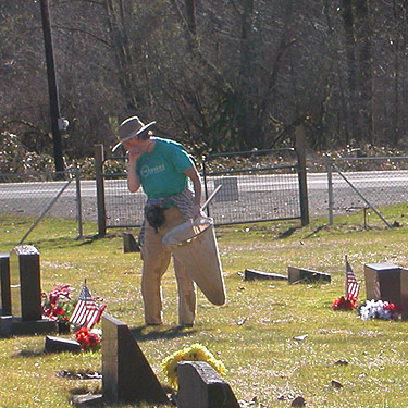 Laurel Ramseyer checking tombstones for spiders, Rainey Valley Cemetery, Lewis County, Washington