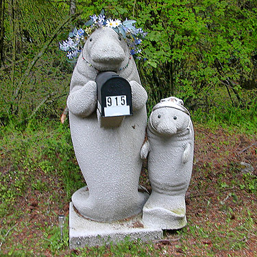 statue with mailbox across road from Reuben Tarte County Park, San Juan Island, Washington