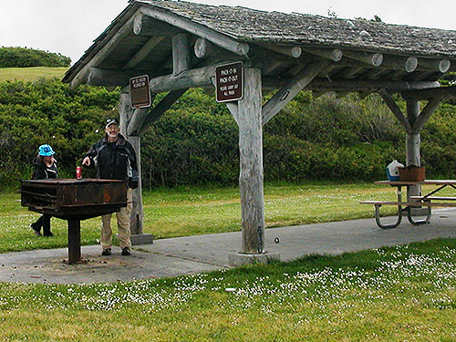Della Scott and Jerry Austin preparing to picnic at Joseph Whidbey State Park, north of Swantown Lake, Whidbey Island, Washington