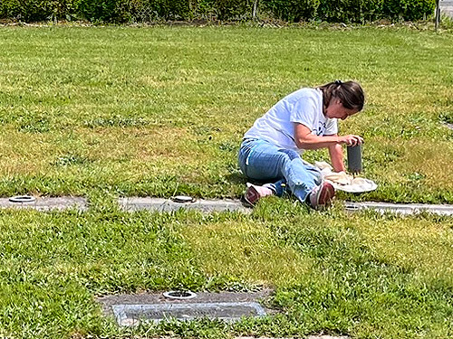 Kathy Whaley sampling grave vases, Whittle-Hubbard Cemetery, Castle Rock, Washington
