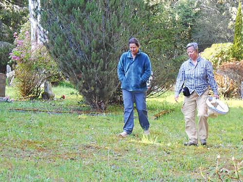 Kathy Whaley and Laurel Ramseyer leaving Humptulips Cemetery near Humptulips, Washington