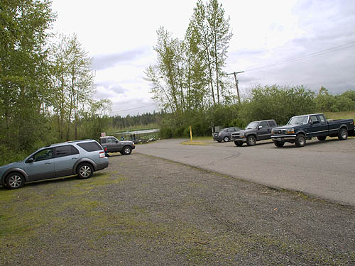 parking lot, shrubs and water at Lake Fazon, Whatcom County, Washington