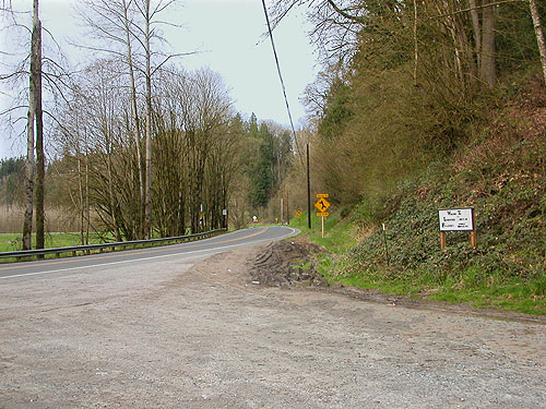 Pioneer Highway (forest tract on left) near Jackson Gulch mouth, Snohomish County, Washington
