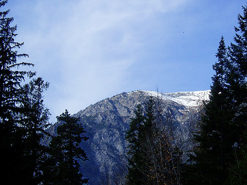 snow on the high ridges seen from Johnny Creek Campground, Chelan County, Washington