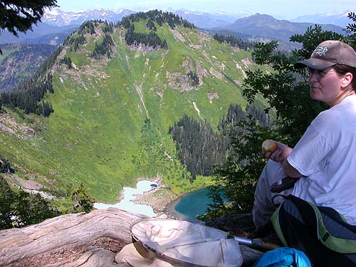 Angela Winner views Sauk Lake from summit ridge of Sauk Mountain, Skagit County, Washington