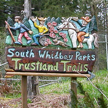 cowboys-&-Indians-themed sign for Trustland Trail, SSW of Langley, Whidbey Island, Washington